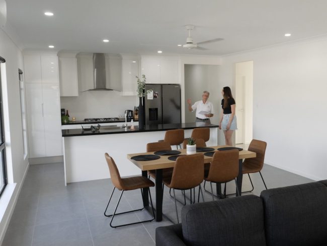 Barry1 Barry talking with a client in the kitchen
