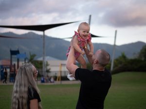 A dad lifts up his baby daughter at Mamu Link Park at Mt Peter